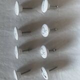white ceramic door knobs with illustration