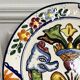 Decorative ceramic plate with griffins