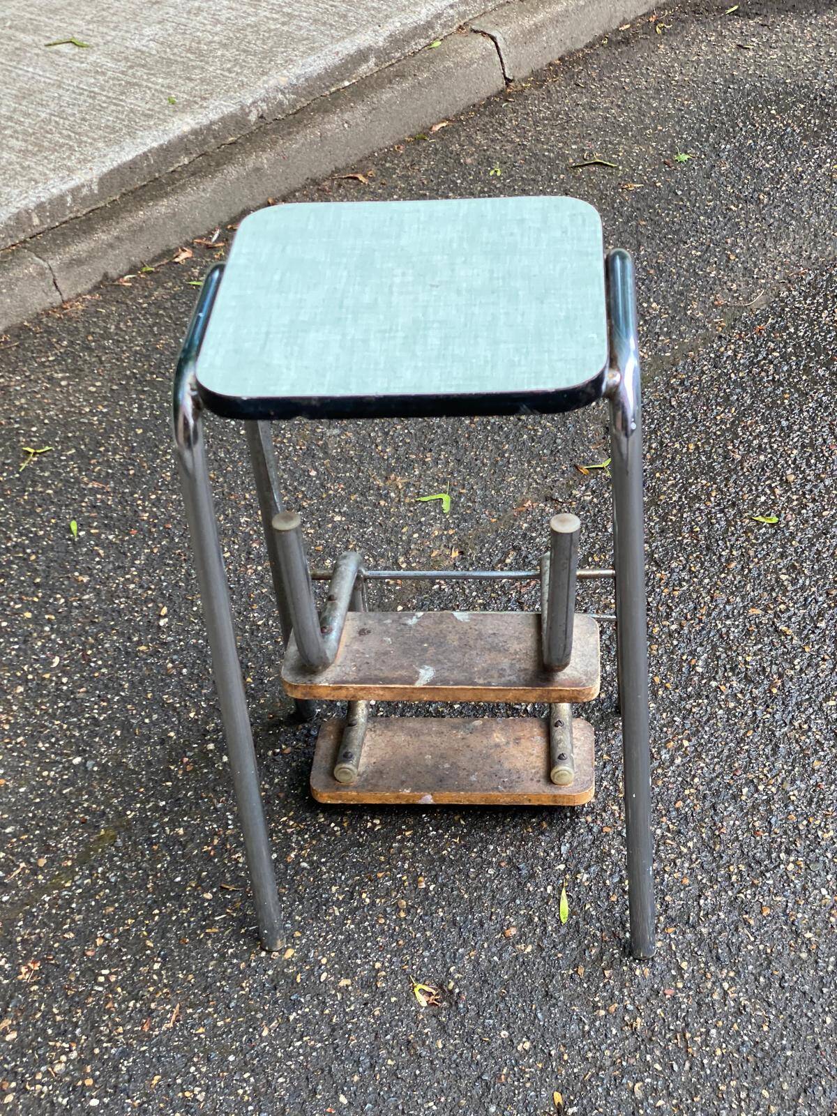 Folding stool in chrome steel, blue formica and solid wood.