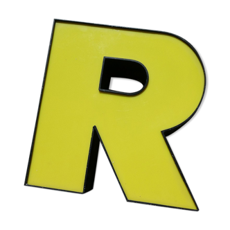 Yellow and black industrial sign "R" letter