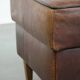 Sturdy vintage sheepskin ottoman in a beautiful large size with black piping