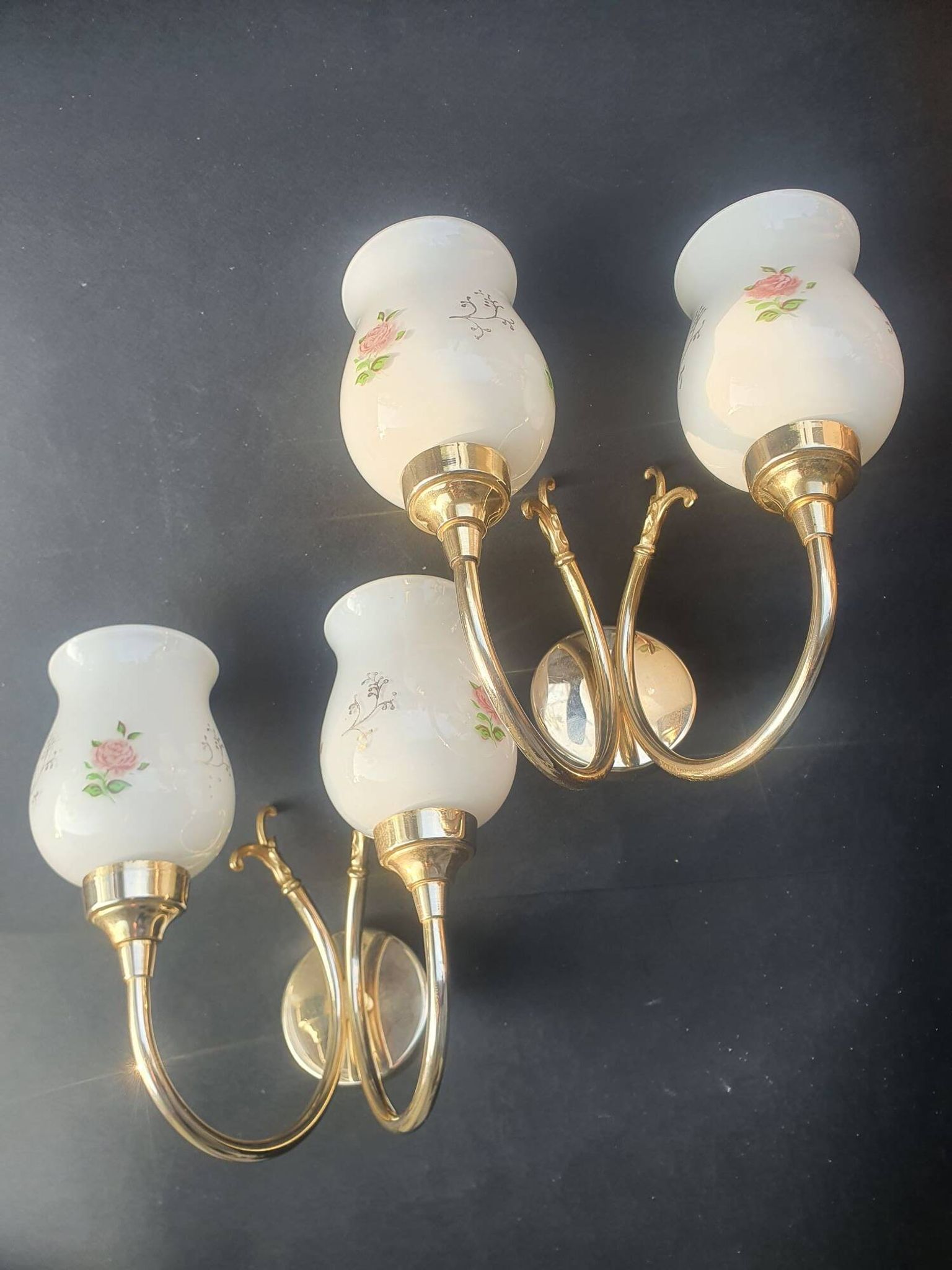 Pair of vintage wall sconces in gilded brass and pink opaline glass.