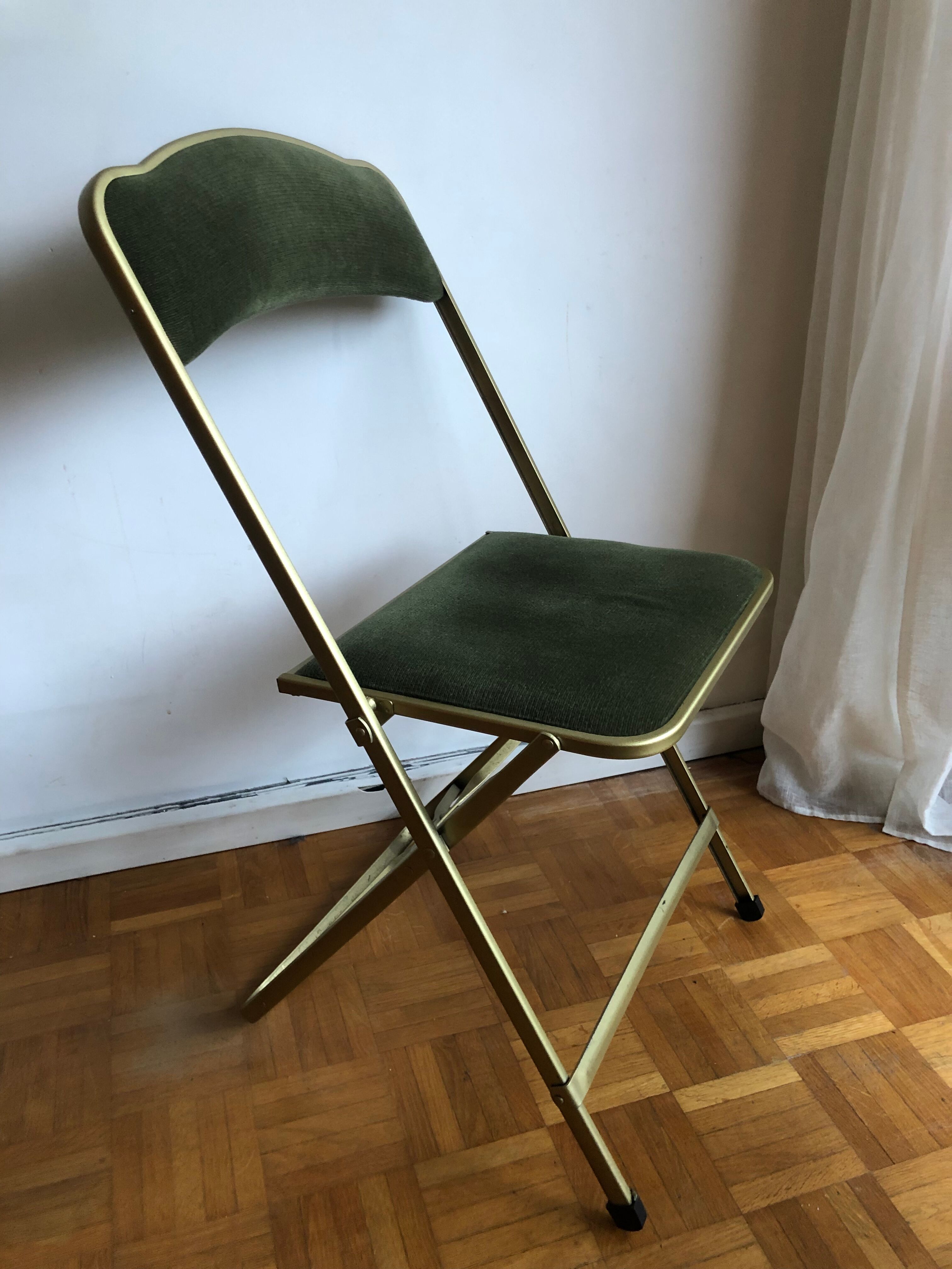 Set of three vintage green folding chairs