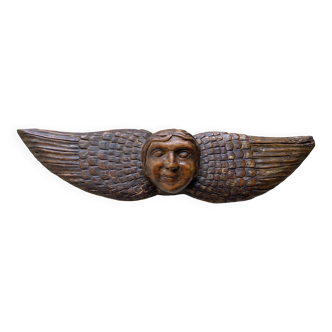 Carved wooden angel head