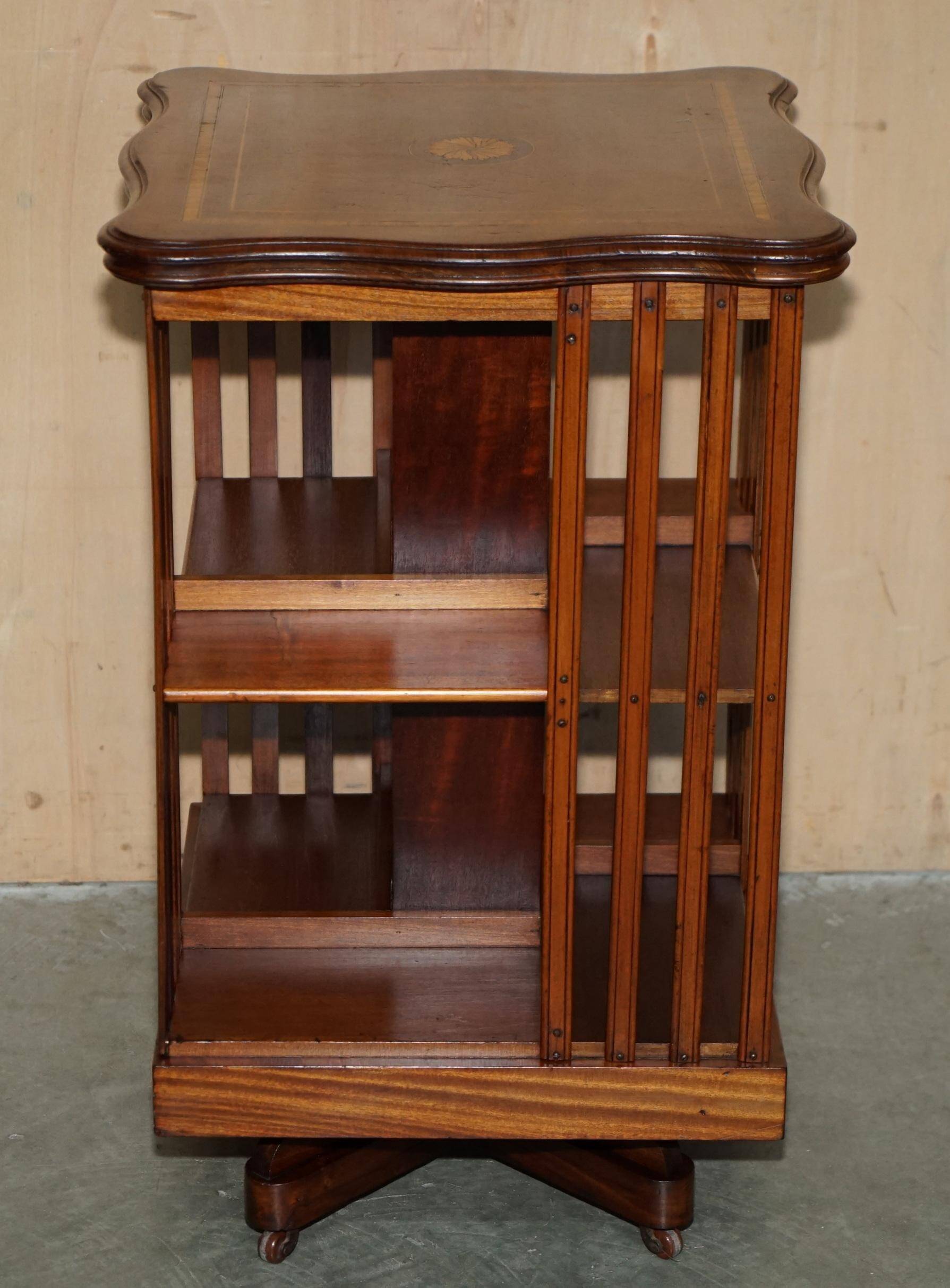 Sheraton-style rotating library table in walnut and satinwood.