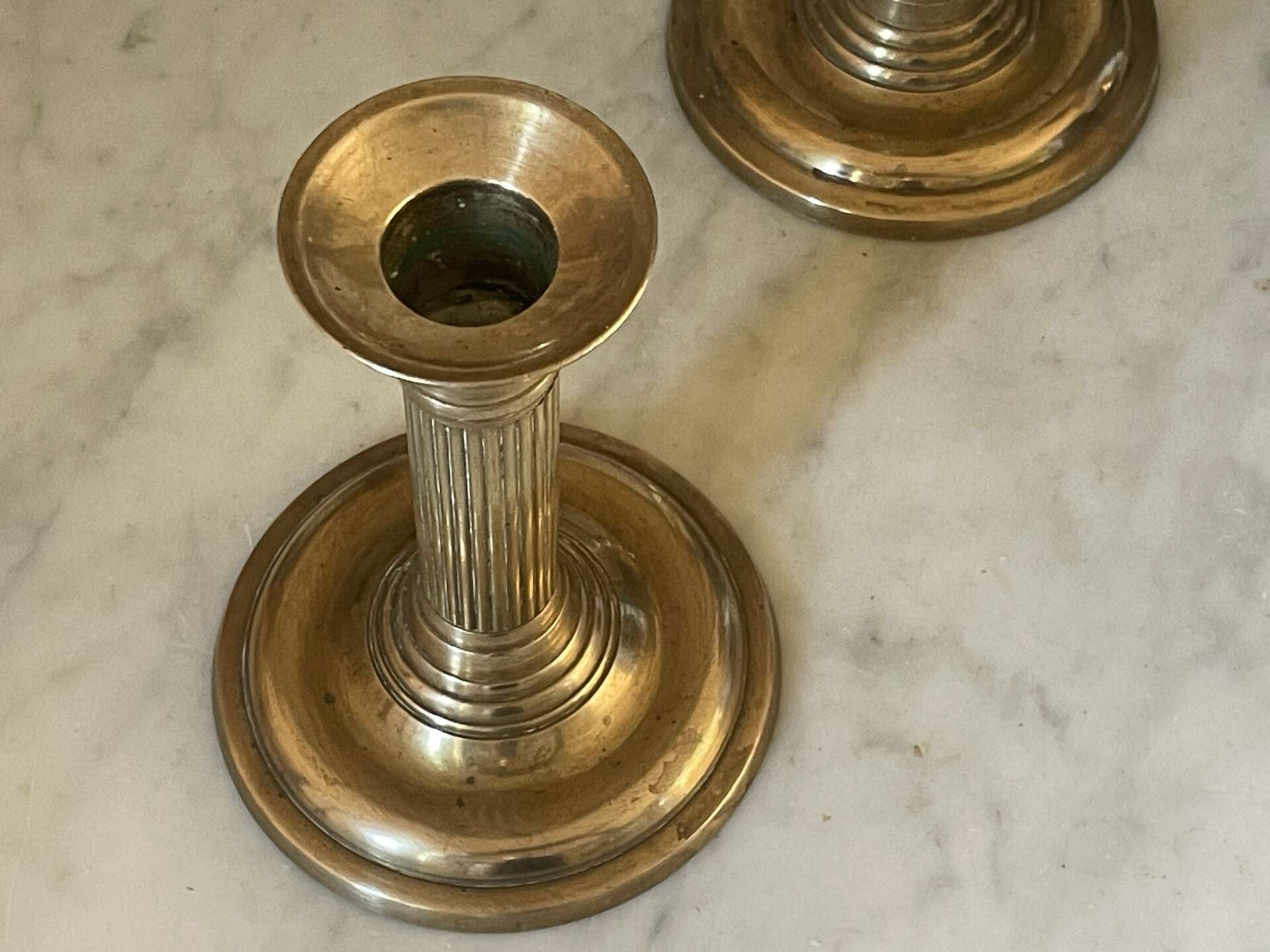 Pair of fluted column candlesticks in brass