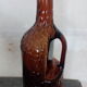 Bouteille à anse verre ambré