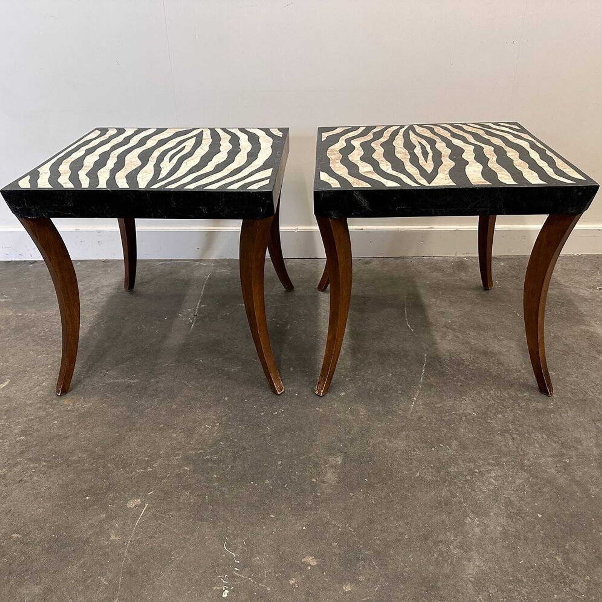 Striking pair of Italian zebra inlaid tessellated stone tables with refined curves