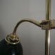 Desk lamp in brass with a swan neck and green opaline glass.