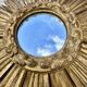 Large sun mirror in carved gilded wood.