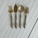 Set de 4 couverts de service anciens