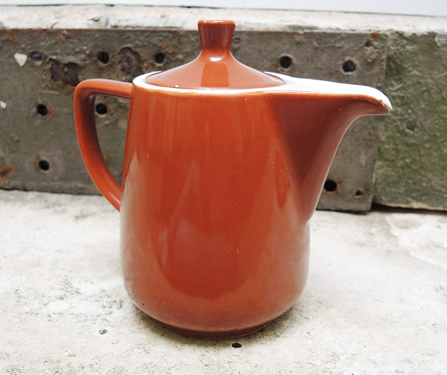 Old brown ceramic coffee maker