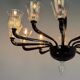 Venetian chandelier in Murano glass in black and colourless, 12 light arms, circa 1990.