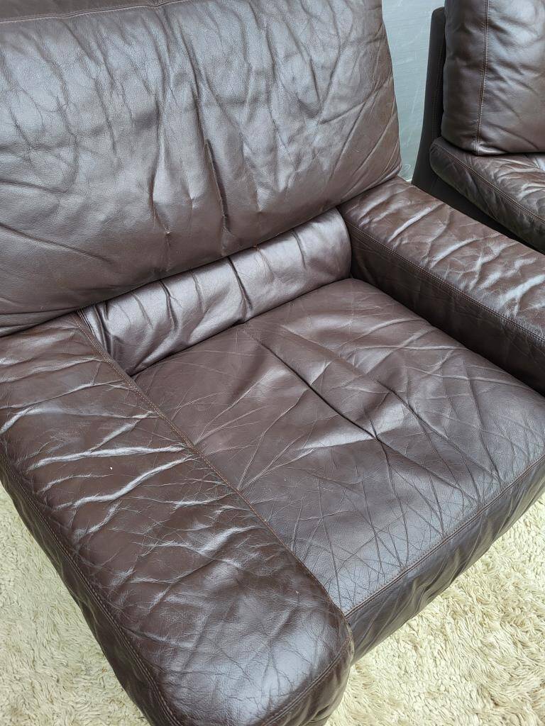 Pair of chocolate leather lounge chairs
