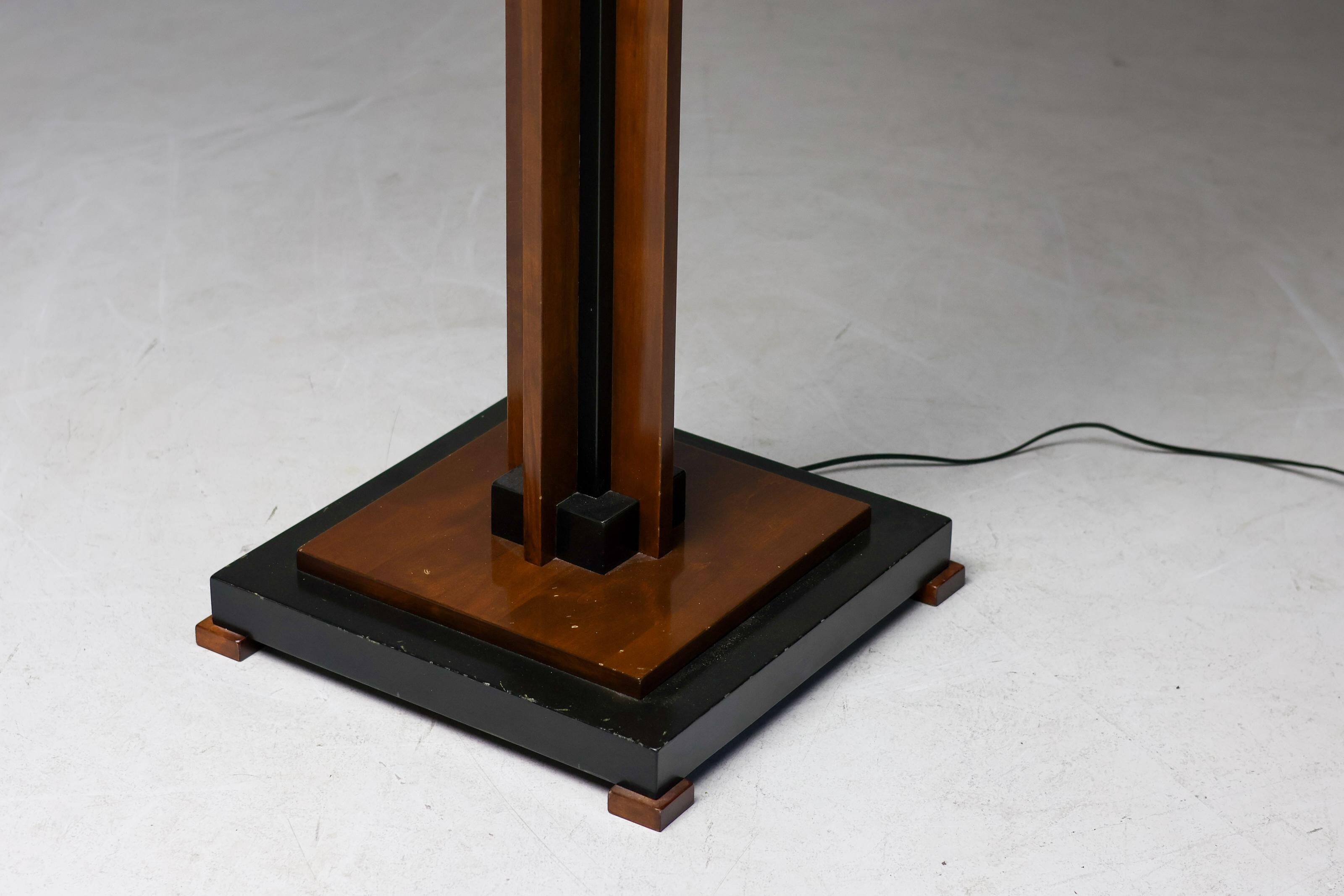 Amsterdam School floor lamp in partially ebonised cherry with a black linen shade.