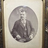 Old photograph of a man in a spelter frame