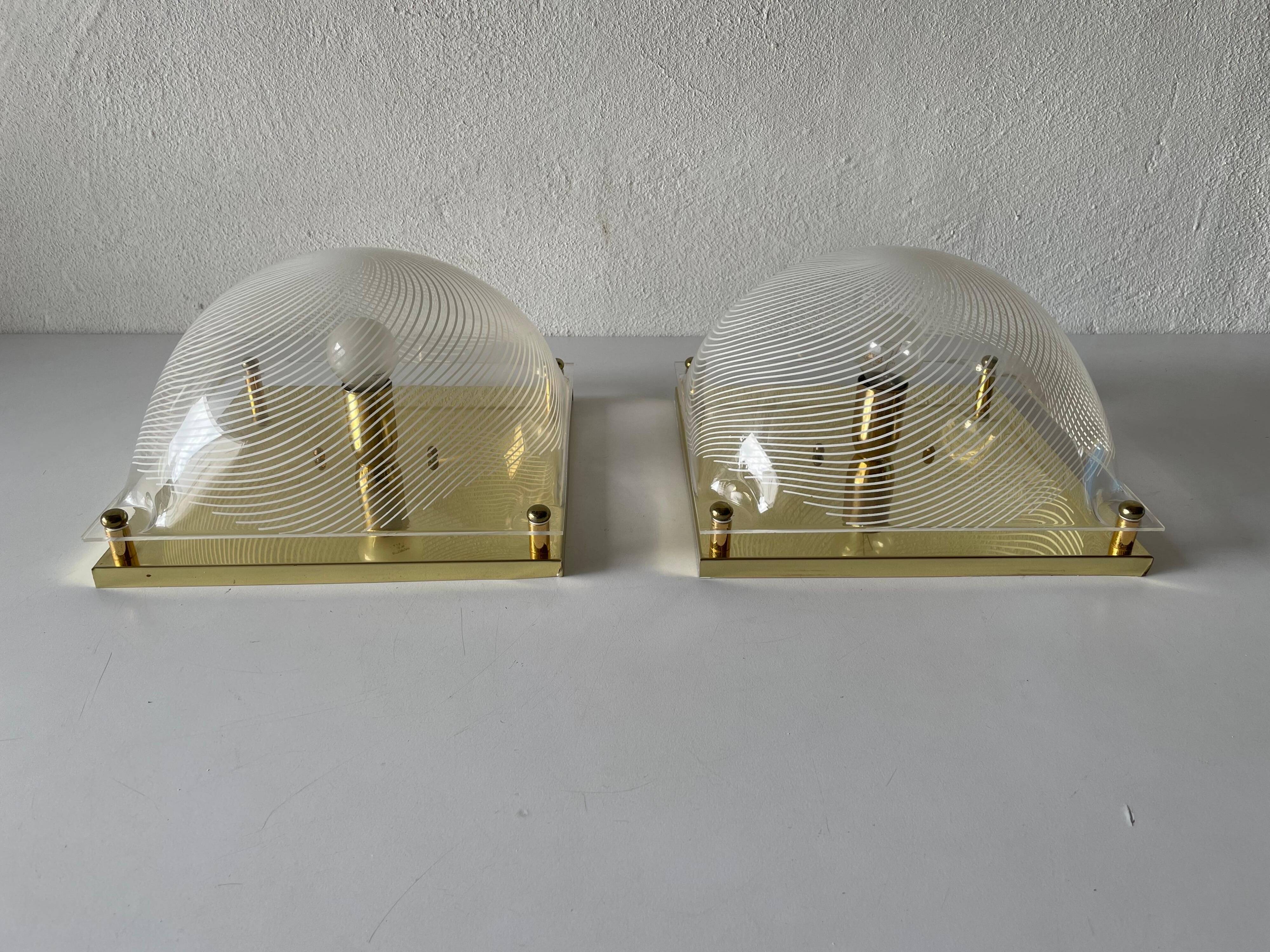 Pair of wall lights or flush mounts in plexiglass by Leola, 1970s, Germany.