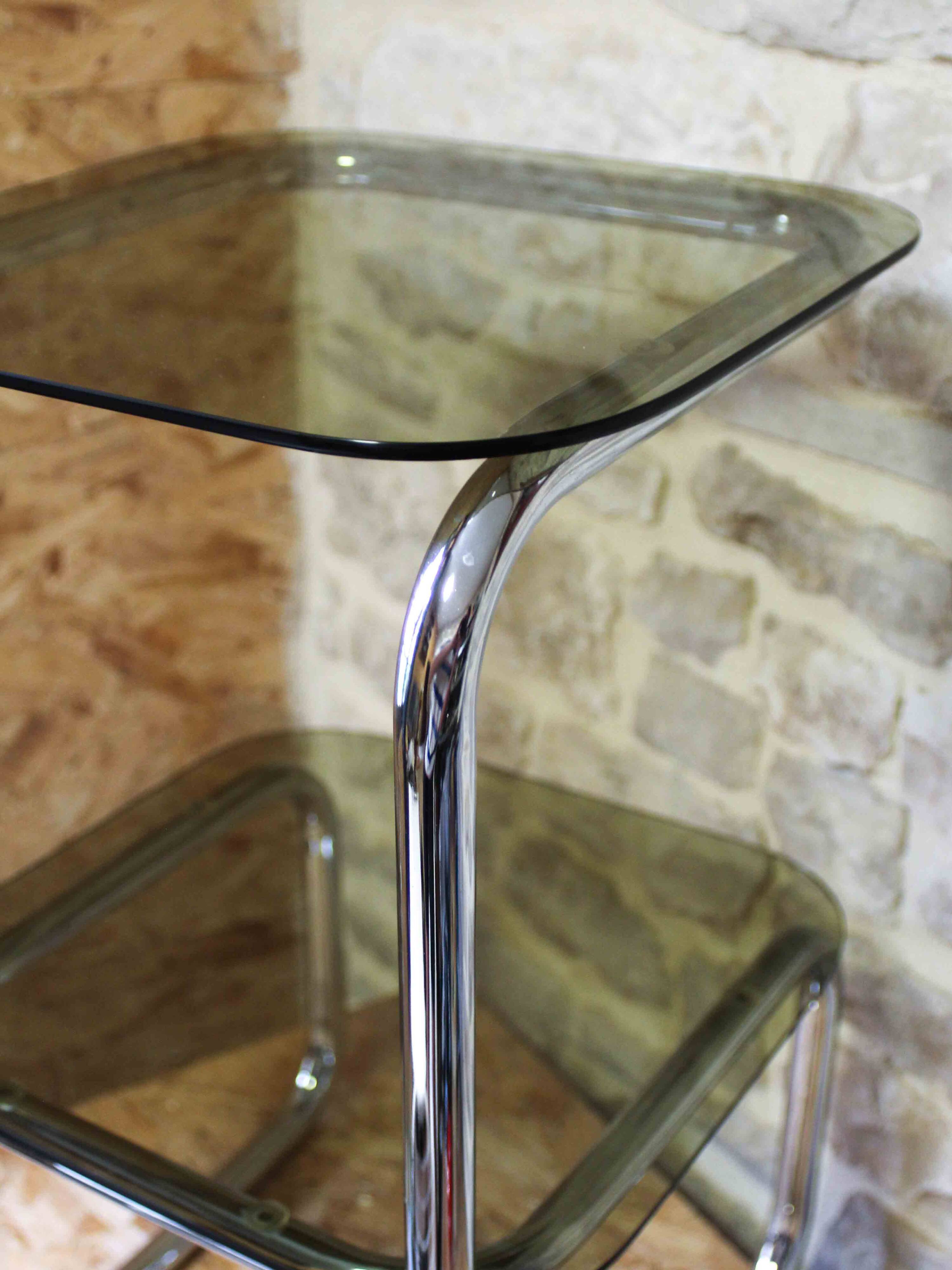 Chrome metal and smoked glass side table.