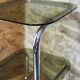 Chrome metal and smoked glass side table.