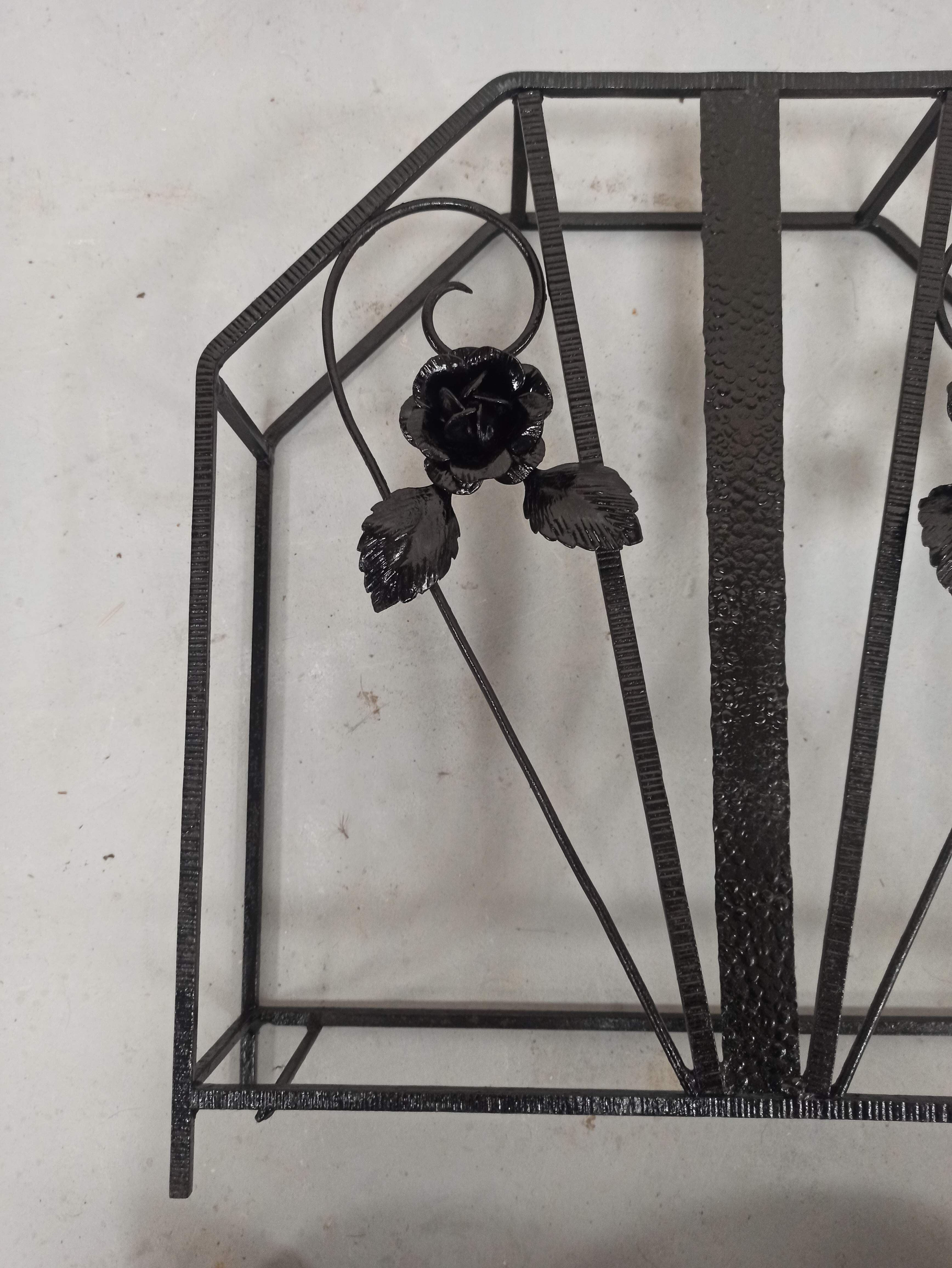 Pink-decorated iron umbrella door.