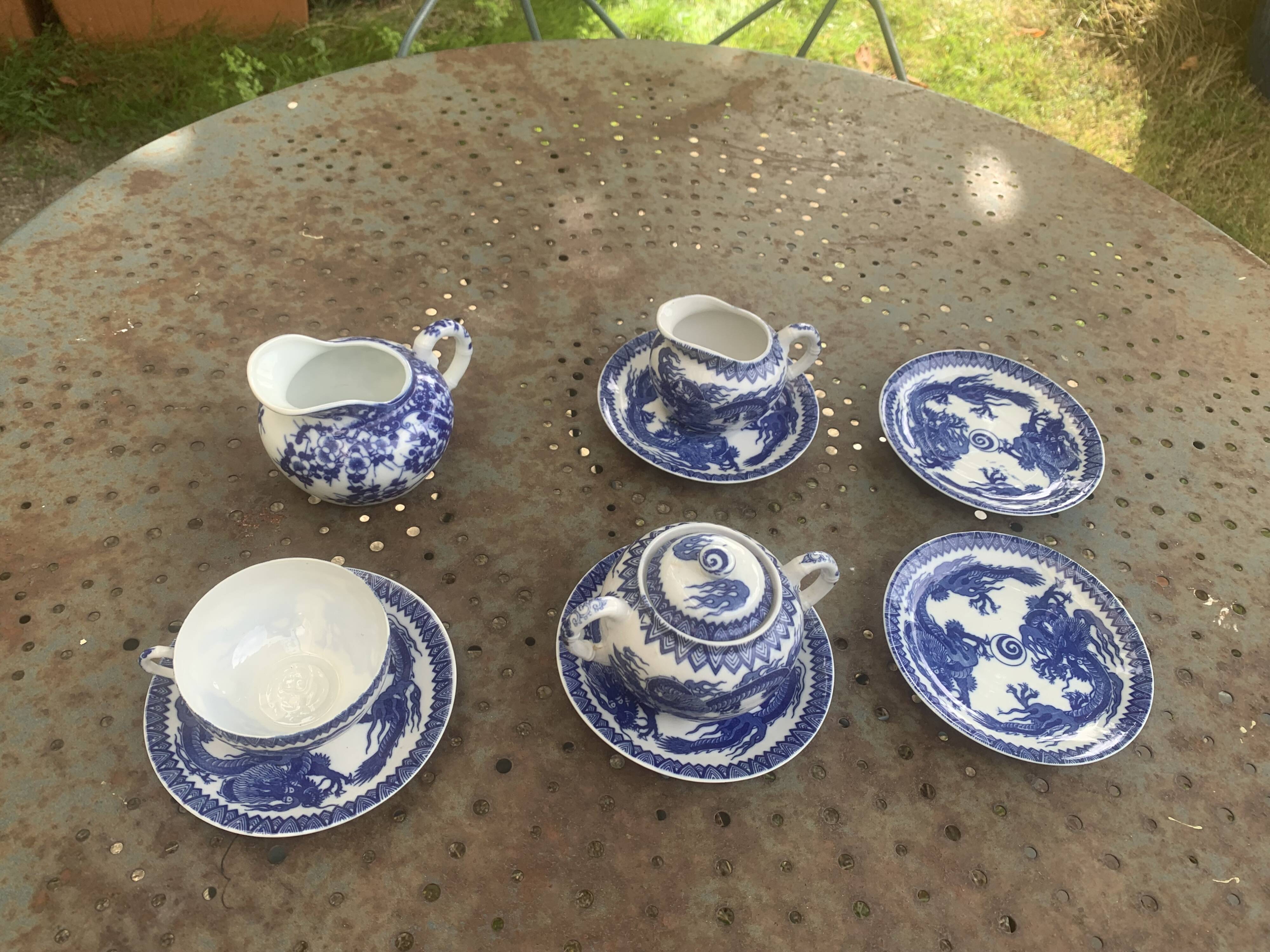 Porcelain tea set with dragon or cherry blossom motif