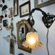 Art Nouveau wall light in wrought iron with vine decoration, early 20th century.