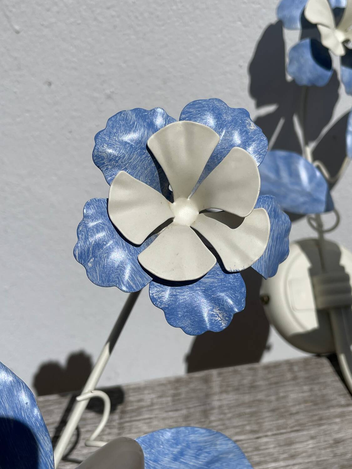 Pair of blue metal floral wall lights