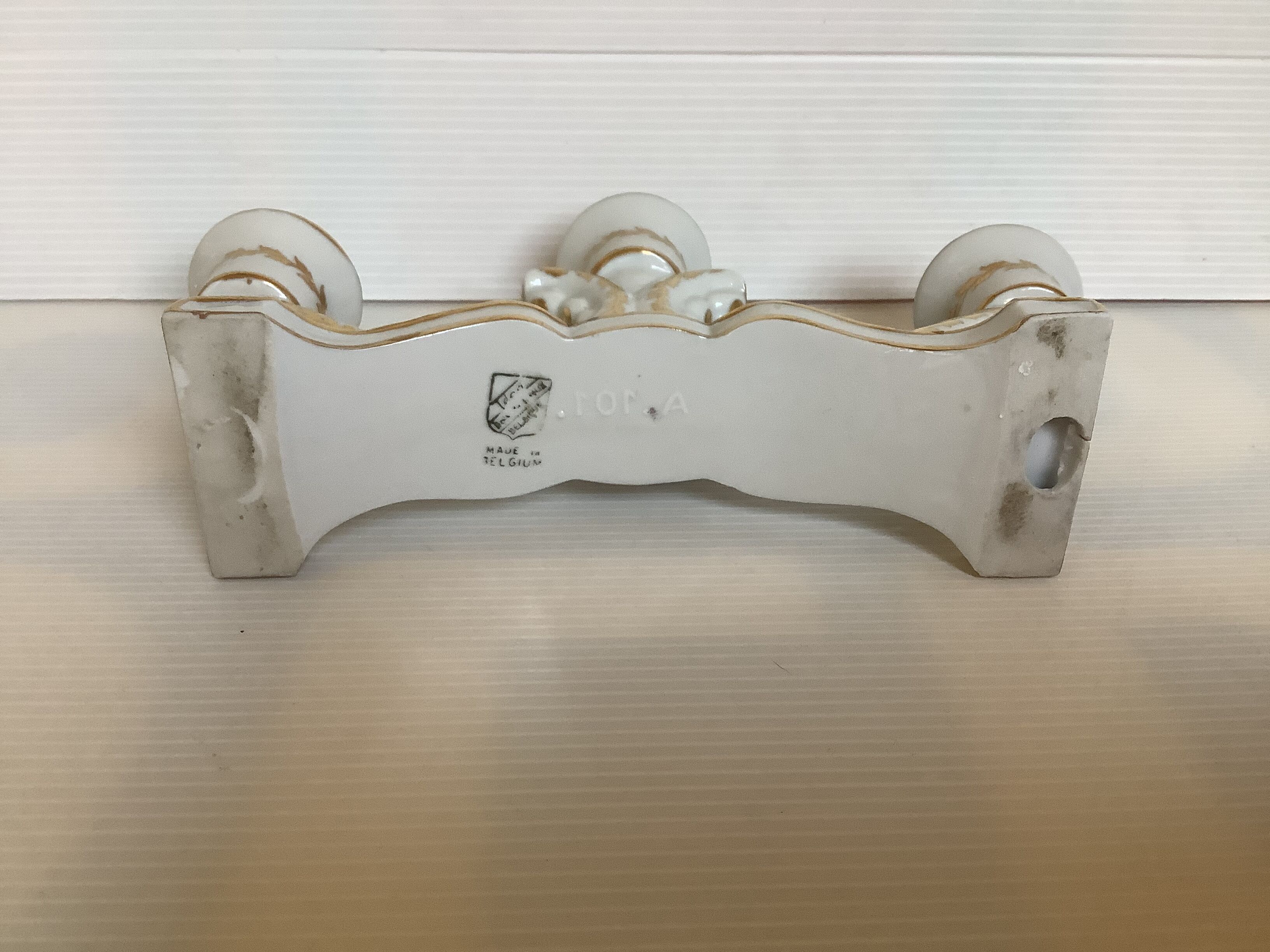 Old white and gold candlestick Belgium