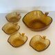 Amber glass dessert service in the shape of an apple made in Italy.