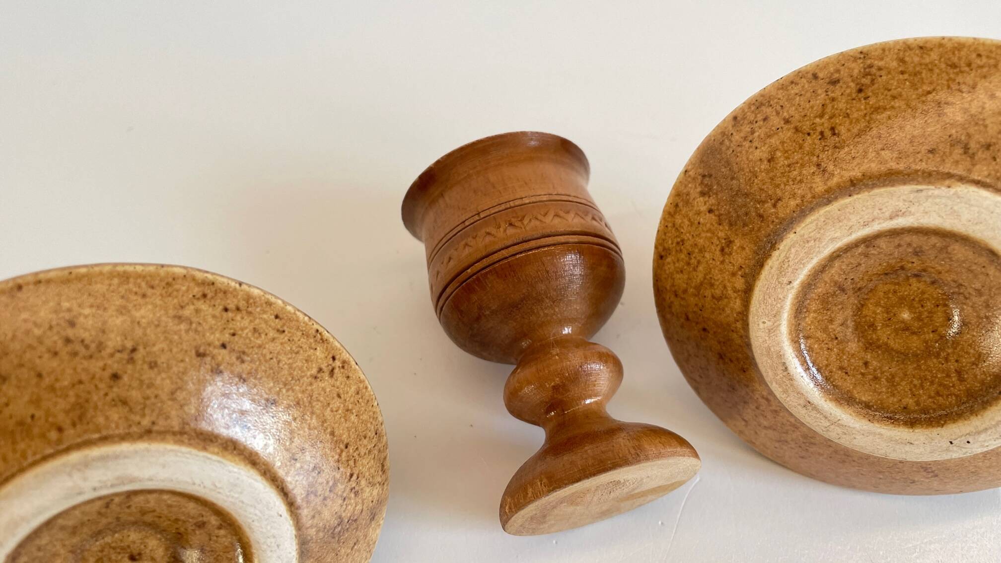 Trio of vintage ceramic and wood egg cups