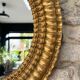 Pair of antique oval mirrors gilded with gold leaf and mercury.