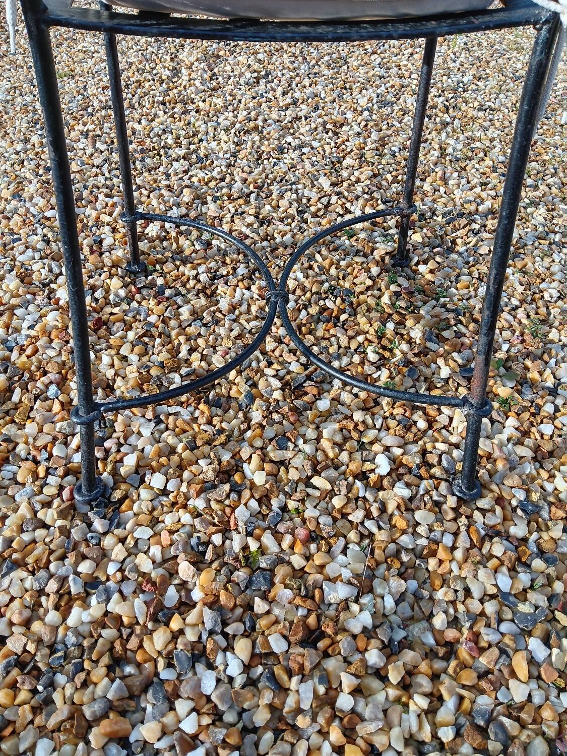Wrought iron chairs with cushions