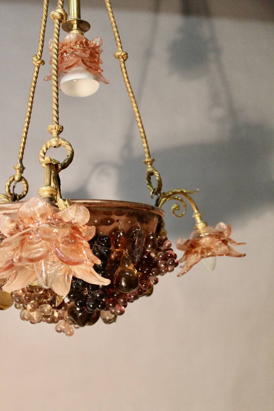 Bronze three-armed chandelier with a grape decoration.