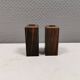 A set of salt and pepper shakers in rosewood