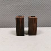 A set of salt and pepper shakers in rosewood