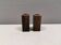 A set of salt and pepper shakers in rosewood
