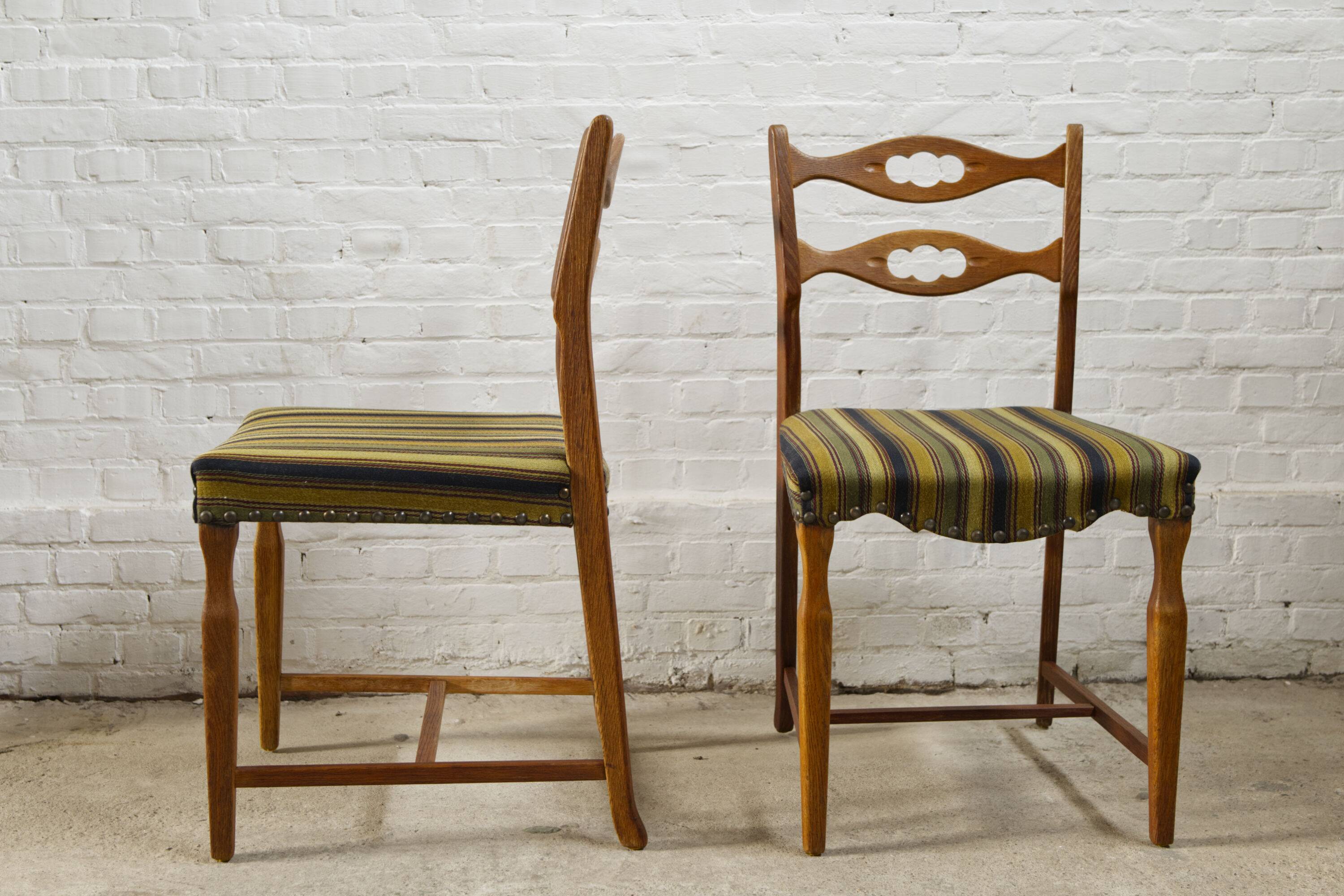 Set of four oak and wool dining room chairs by Henning Kjaernulf, 1960's