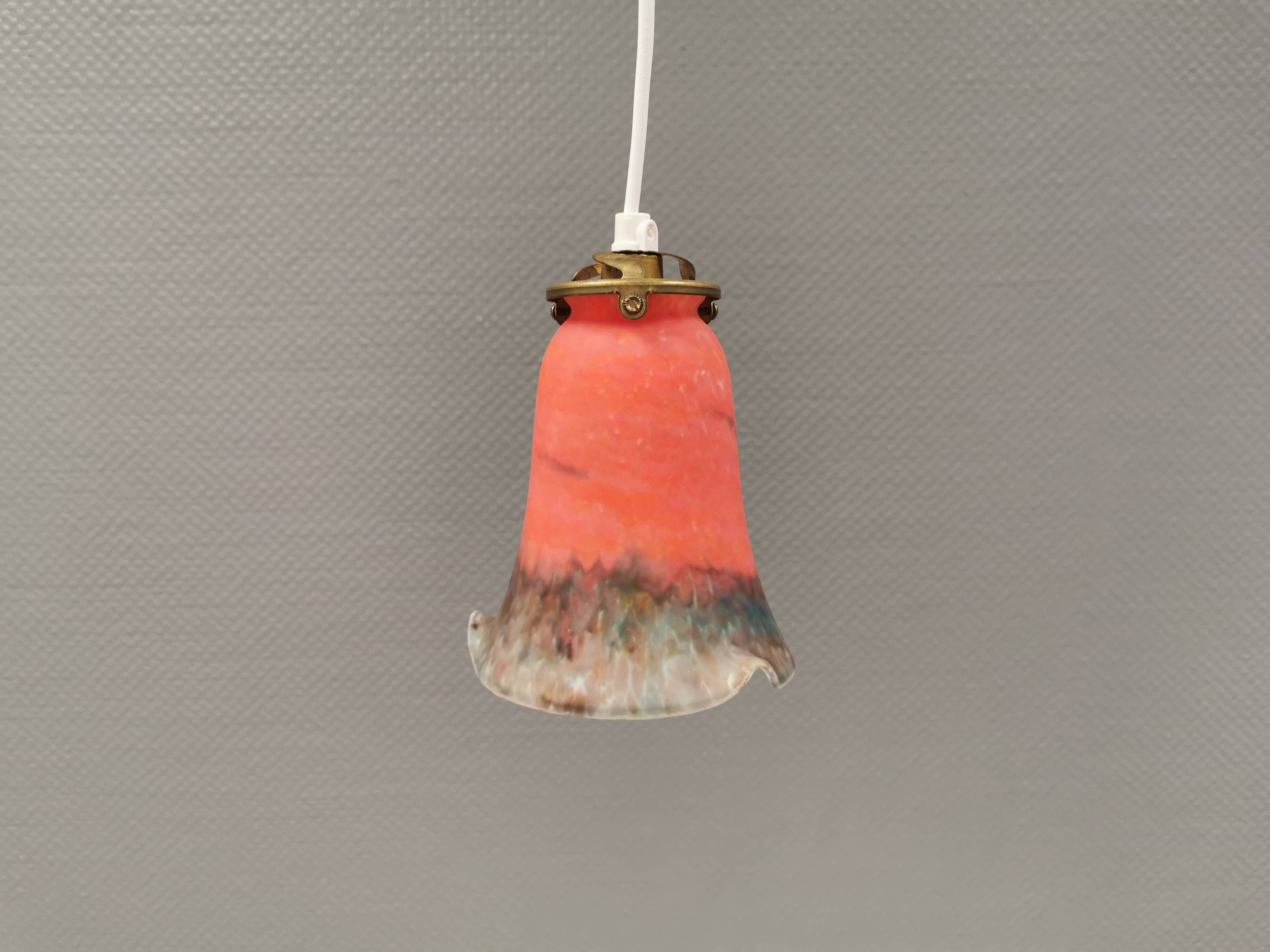 Small, beautiful hanging lamp in Art Deco style with brass top.