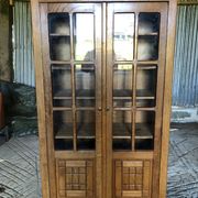 Vintage oak bookcase from the reconstruction period with 2 doors with small panes.