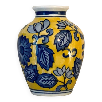 yellow porcelain vase with blue flowers