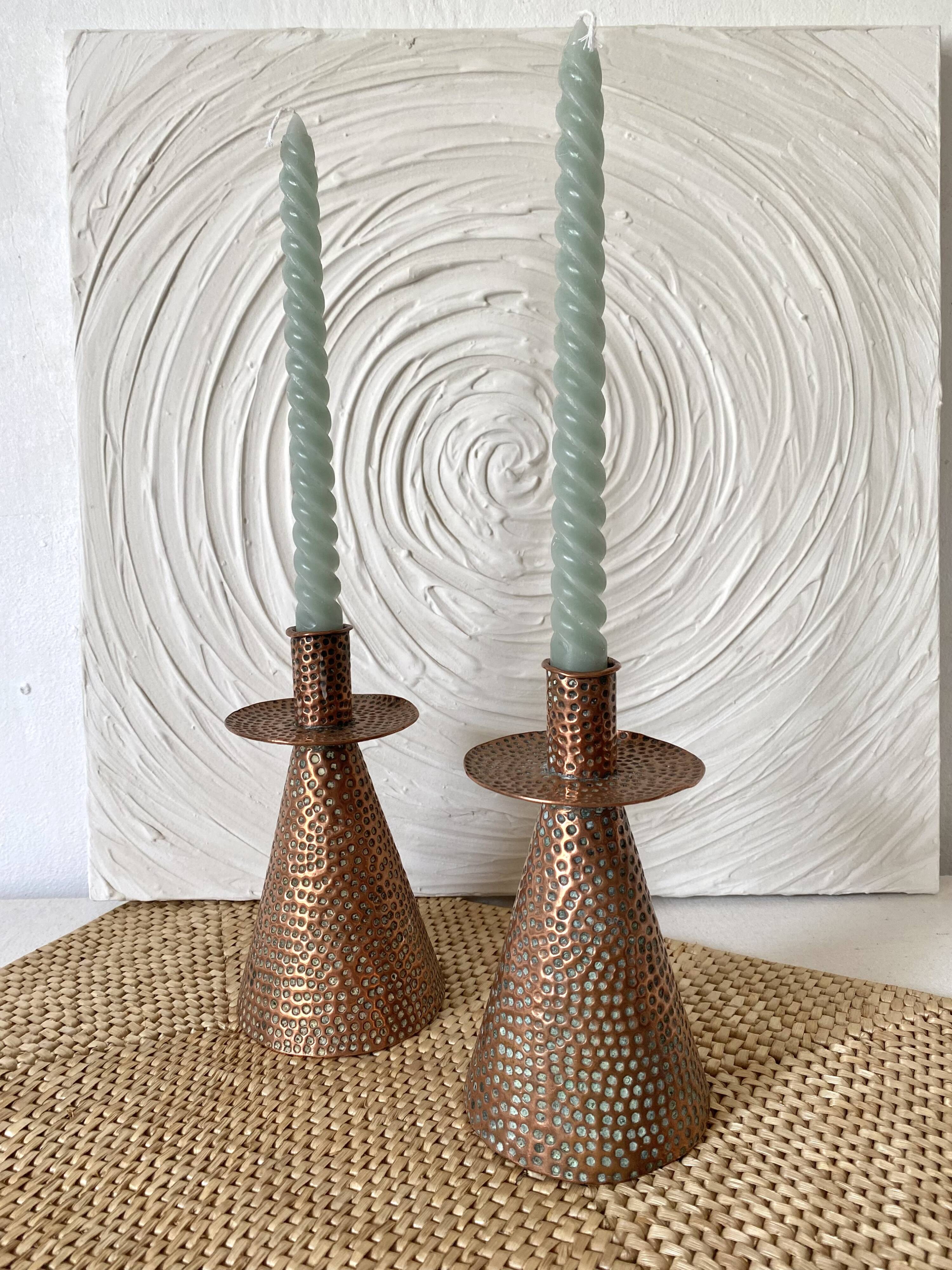 Pair of hammered copper candlesticks from the 1950s