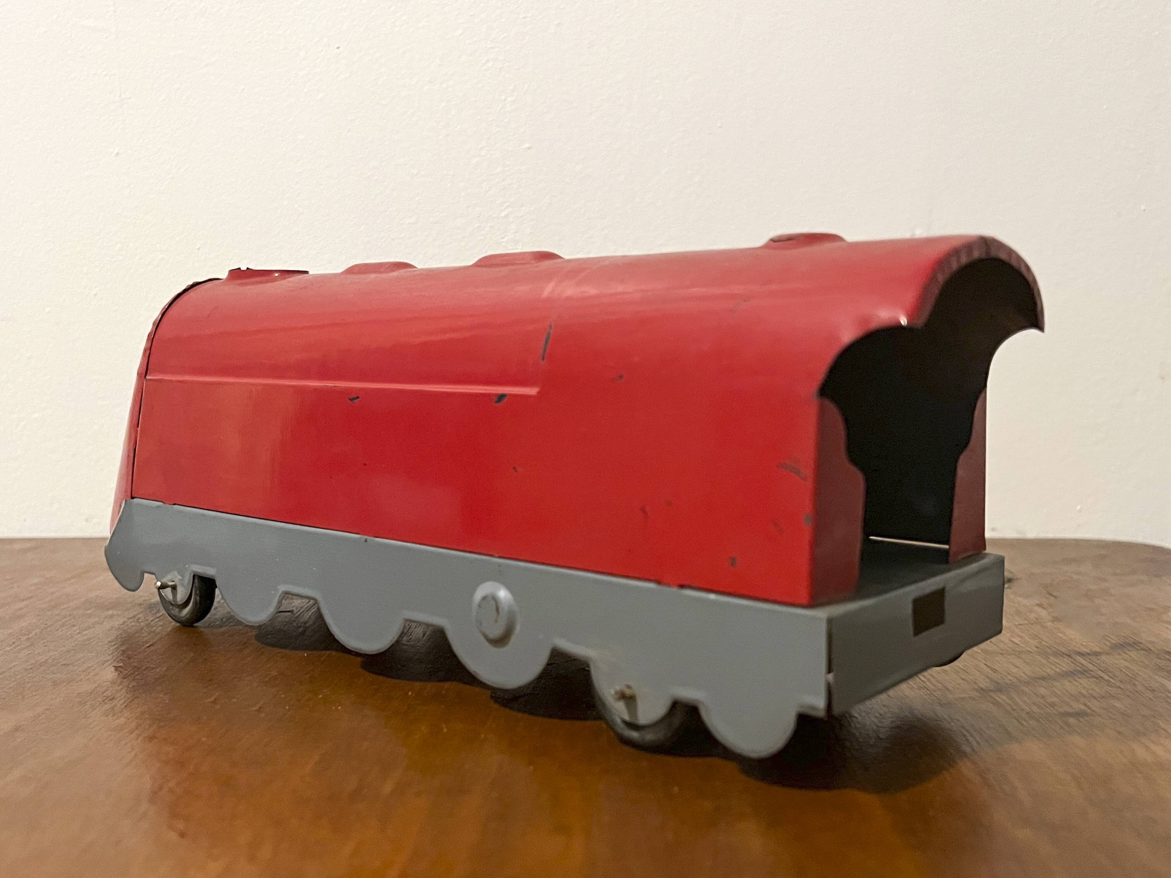 Red sheet metal locomotive 60s