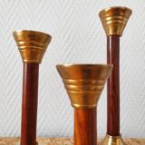Set of three vintage wooden and brass candlesticks