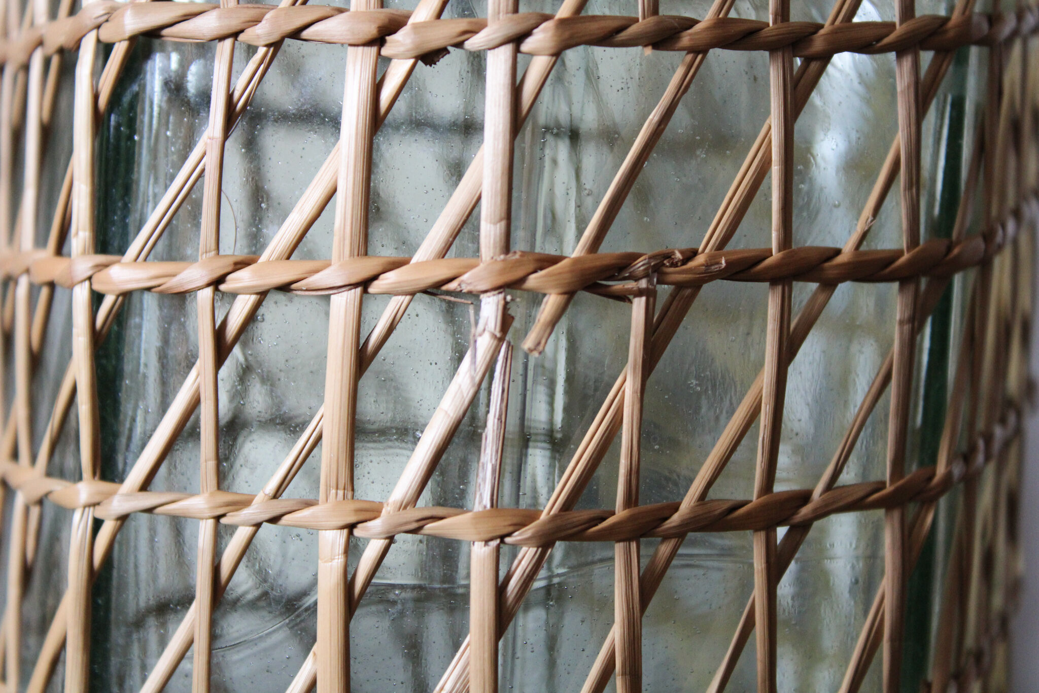 Glass and wicker vase