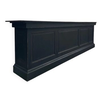 Immense bar counter covered with blue stone.