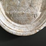 Character on plaster medallion