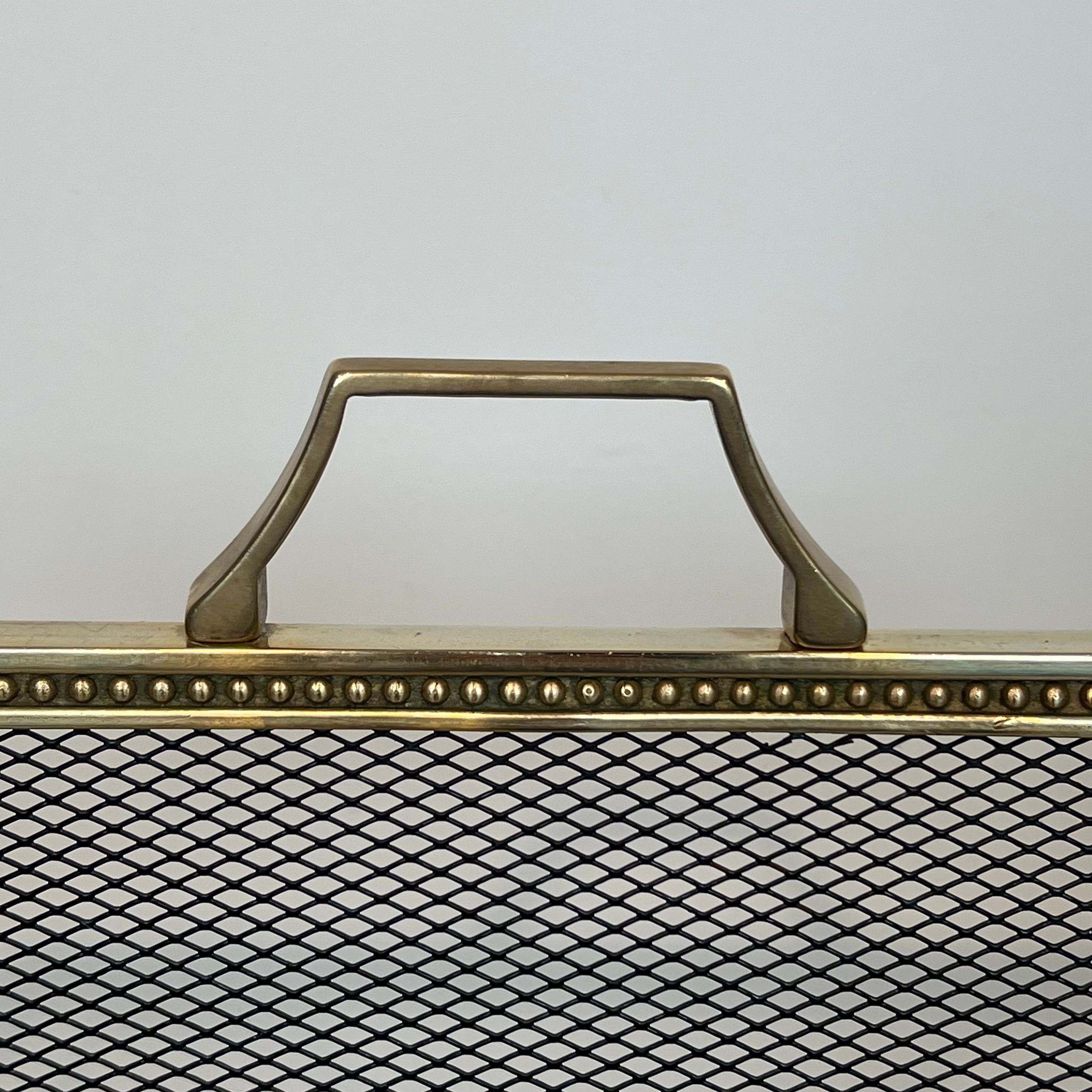 Brass fire screen and grille in the Louis XVI style in the taste of Maison Jansen.