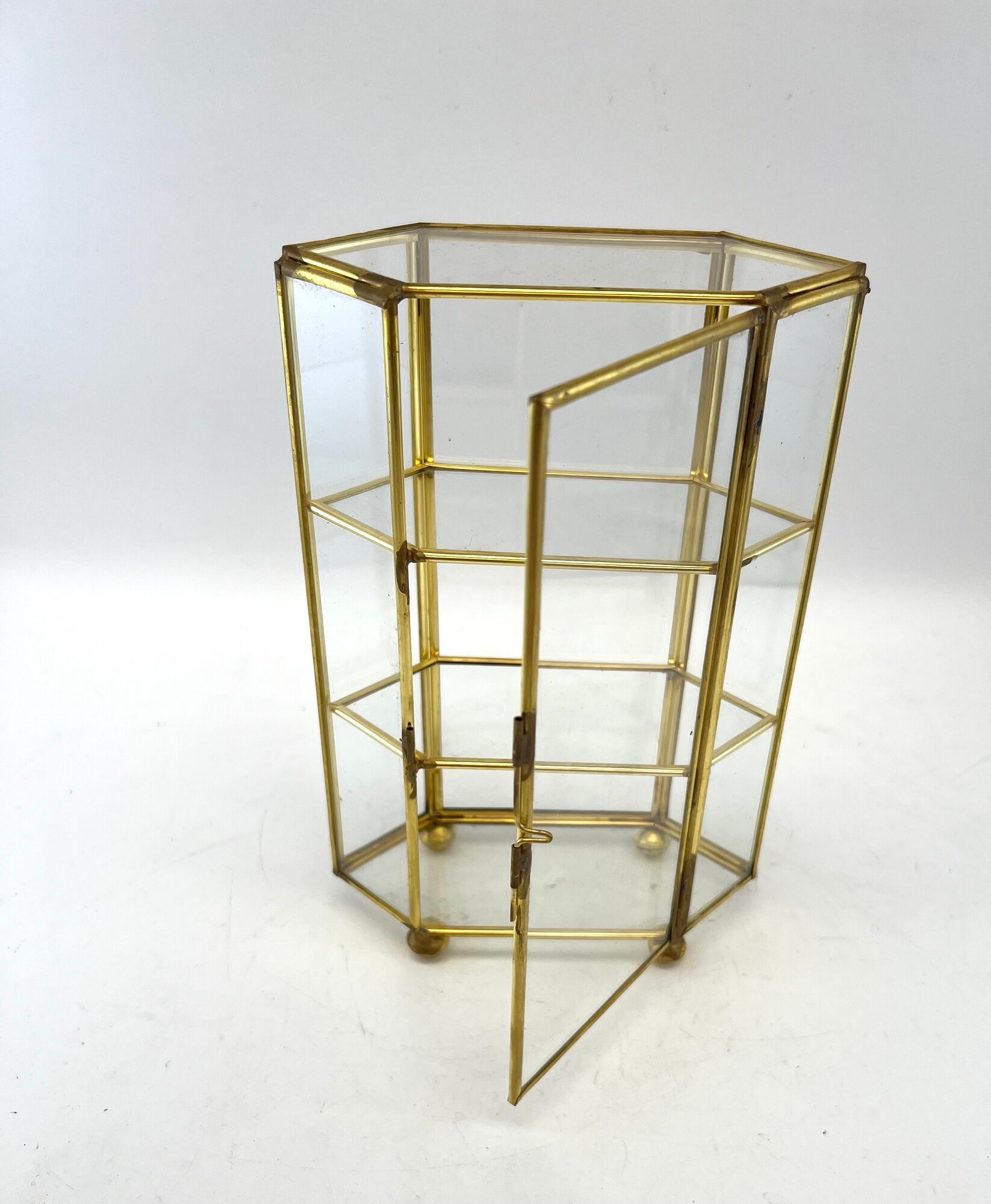 Glass and brass jewelry showcase
