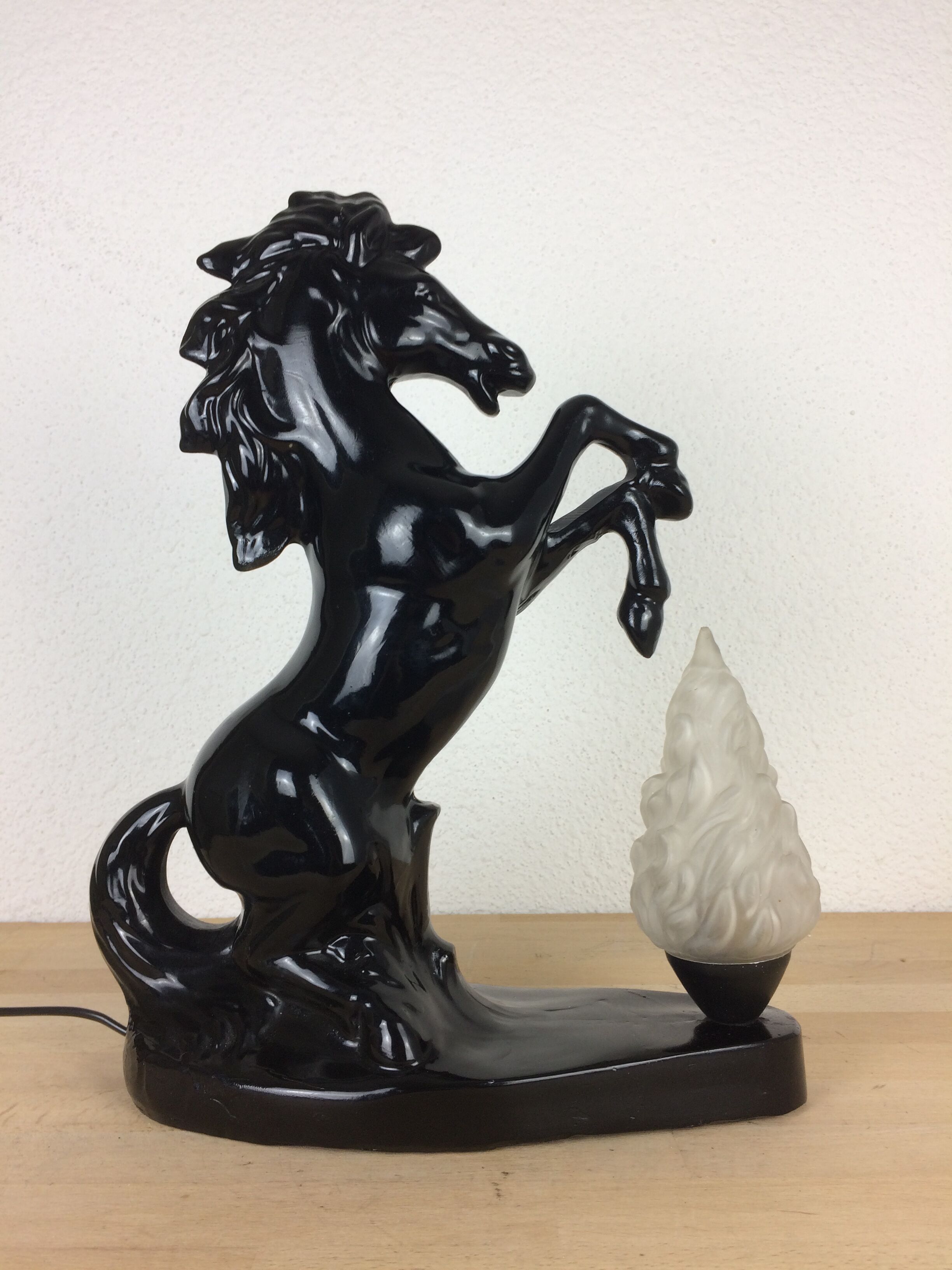 Prancing horse lamp and flame
