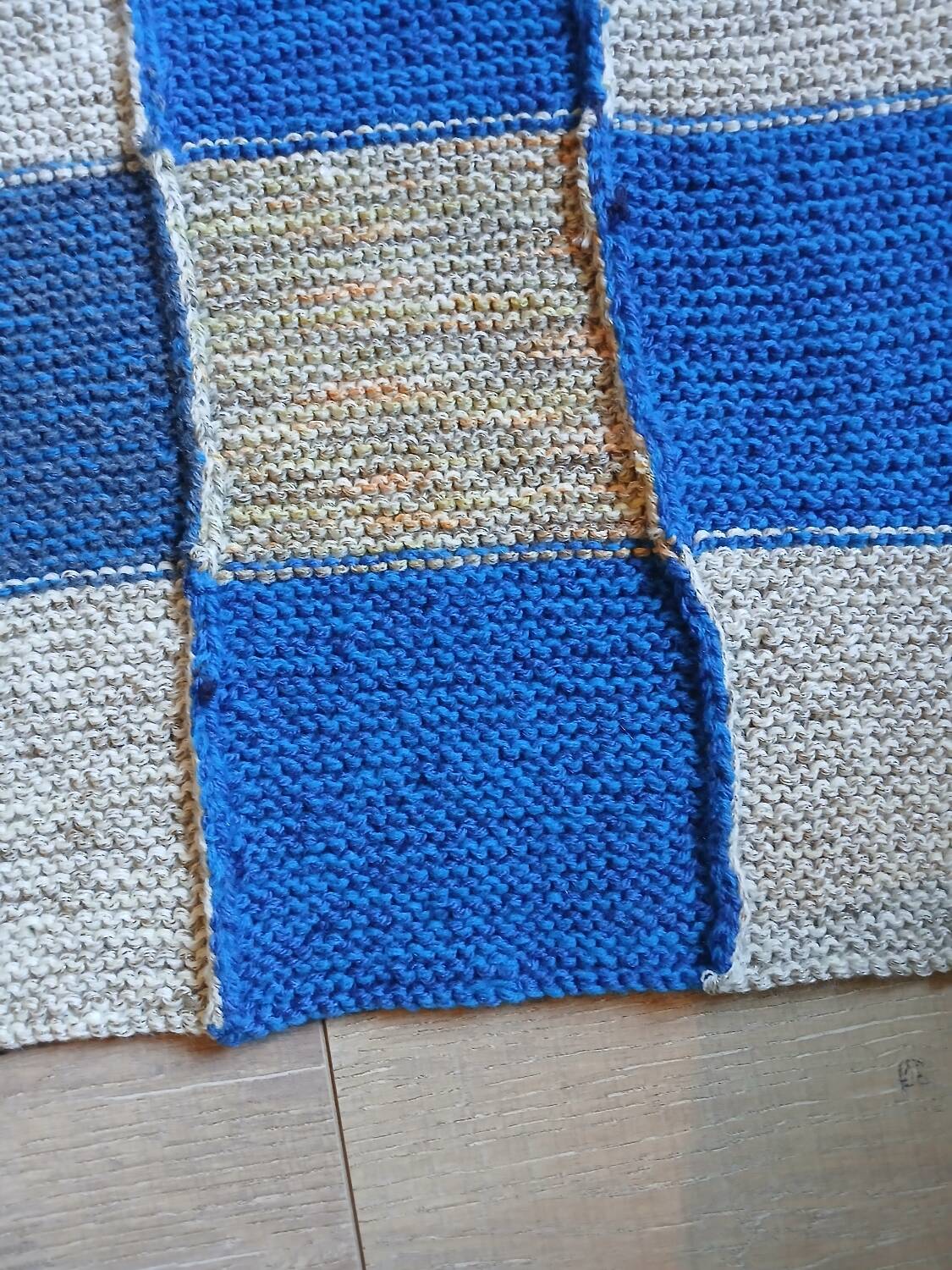 Hand knitted patchwork plaid